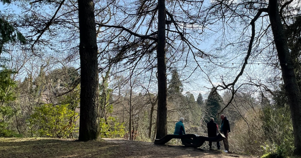 Inverness Ness Islands people sitting looking over the river Ness