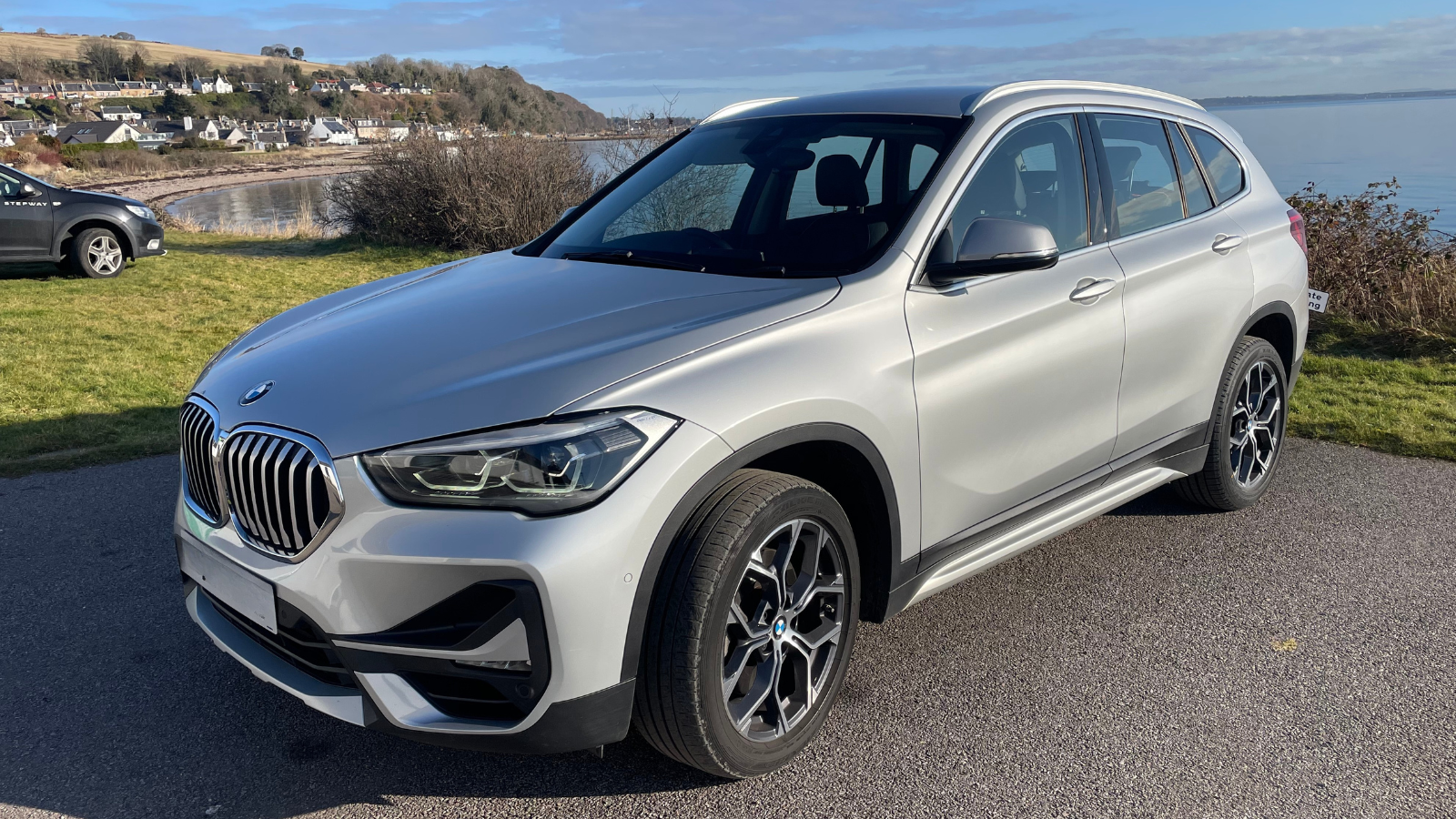 BMWX1 car sitting at harbour