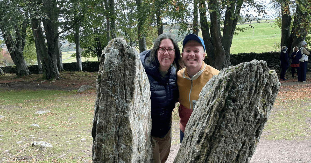Caths Inverness tours guests posing for picture at Split Stone